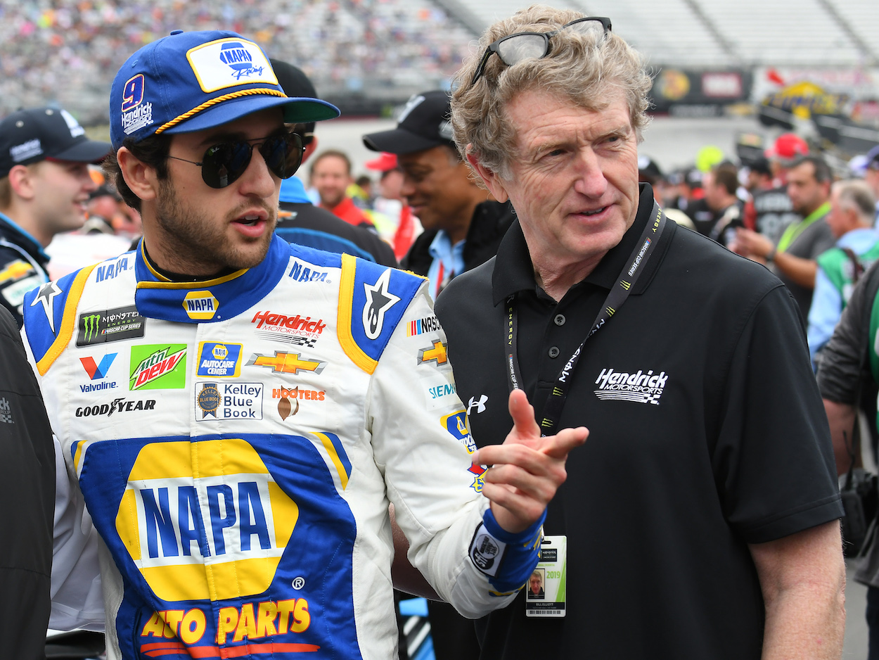 Chase Elliott and Bill Elliott walk together before race