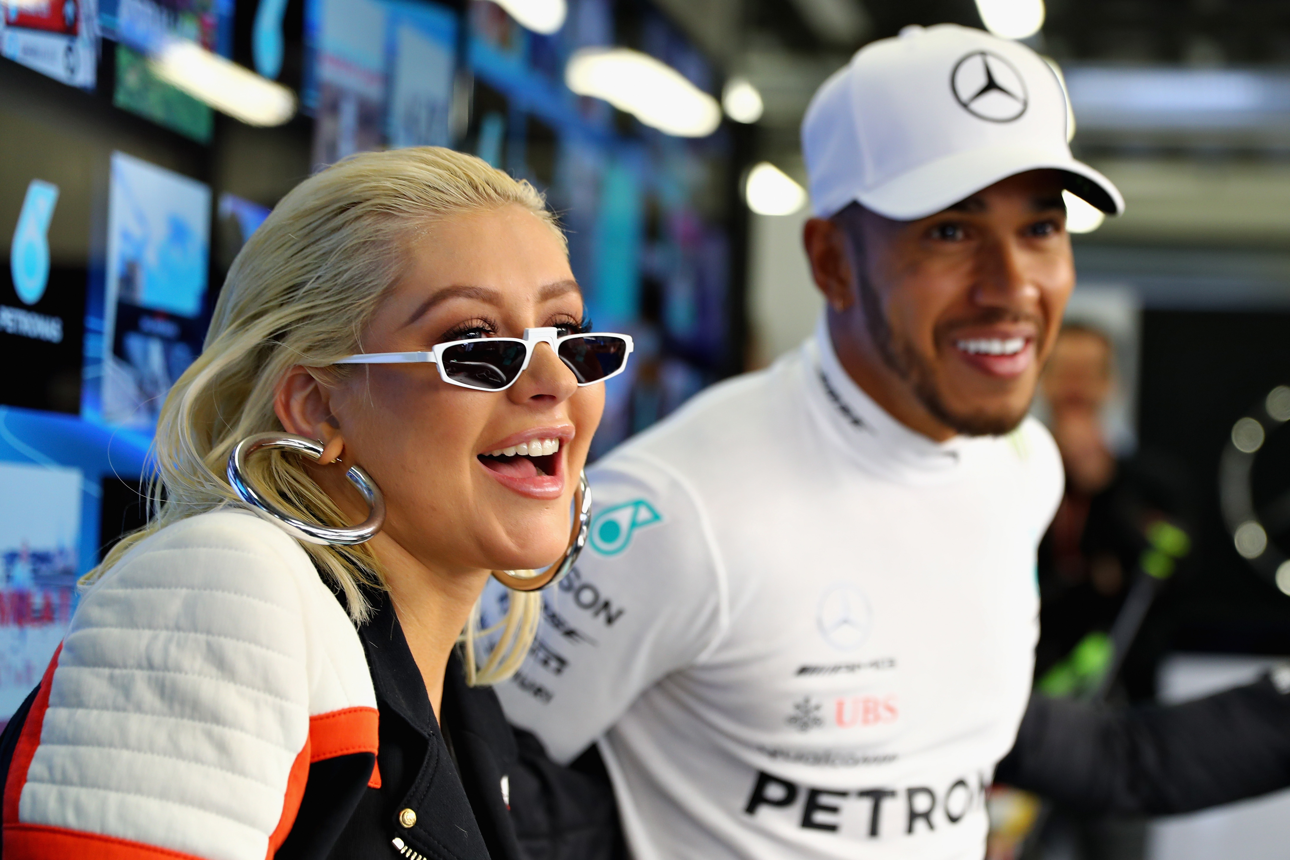 Popstar Christina Aguilera talks with Lewis Hamilton before the 2018 Azerbaijan Formula 1 Grand Prix