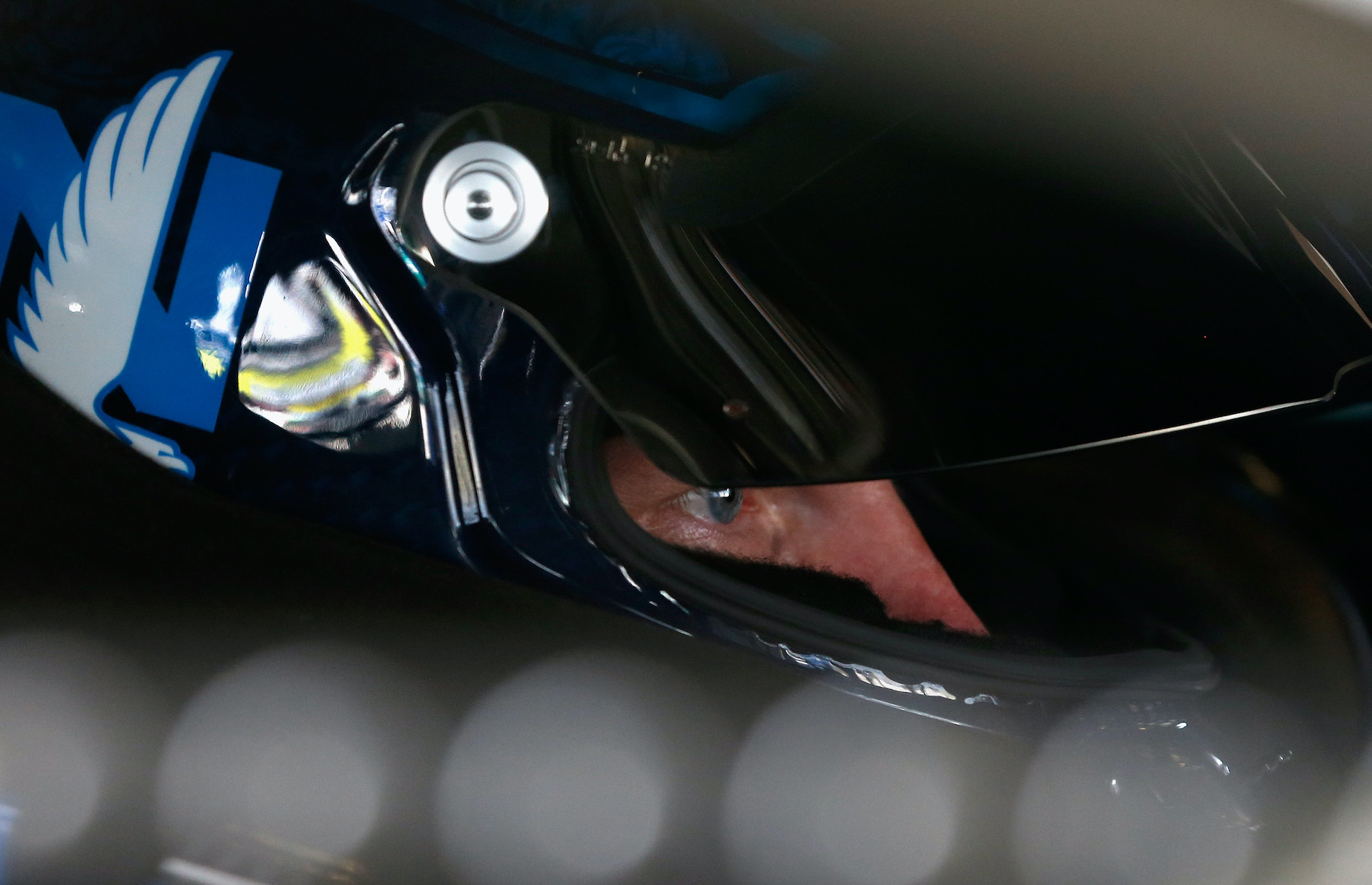 Dale Earnhardt Jr. sits in his car ahead of a 2017 NASCAR race