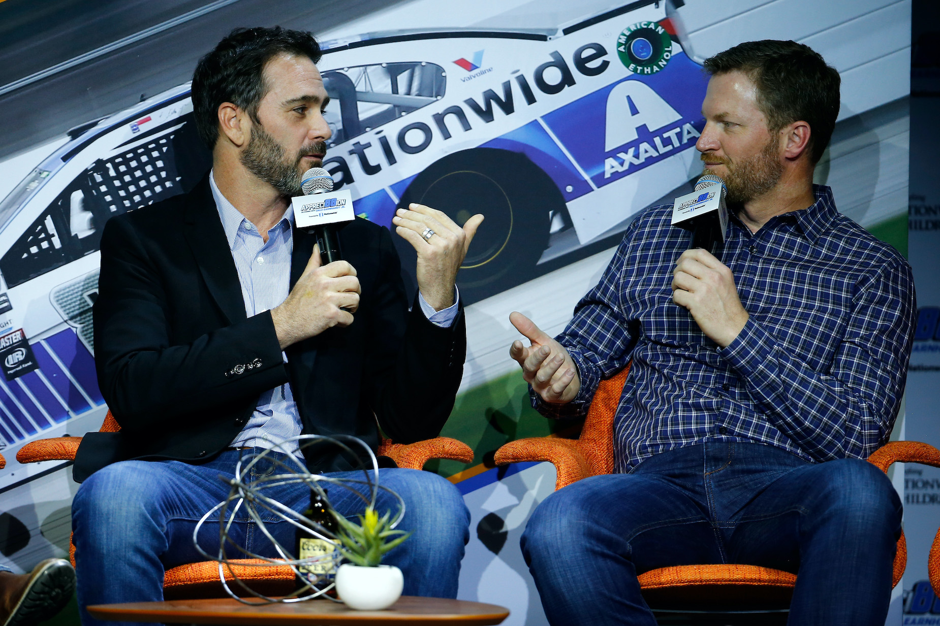 NASCAR drivers Jimmie Johnson (L) and Dale Earnhardt Jr. (R) talk at a 2017 event in Las Vegas.
