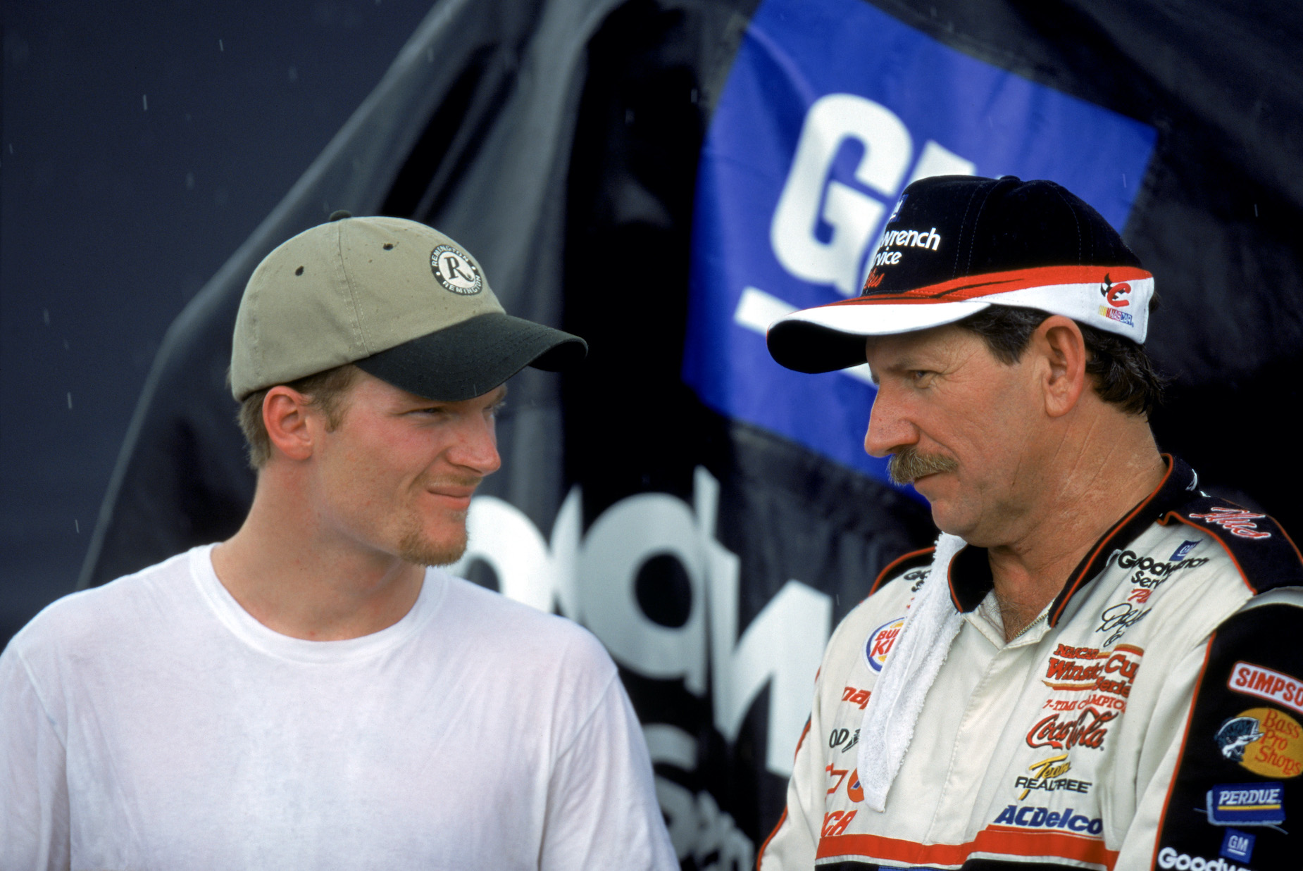 Dale Earnhardt Jr. and Dale Earnhardt Sr. stand together in 2000