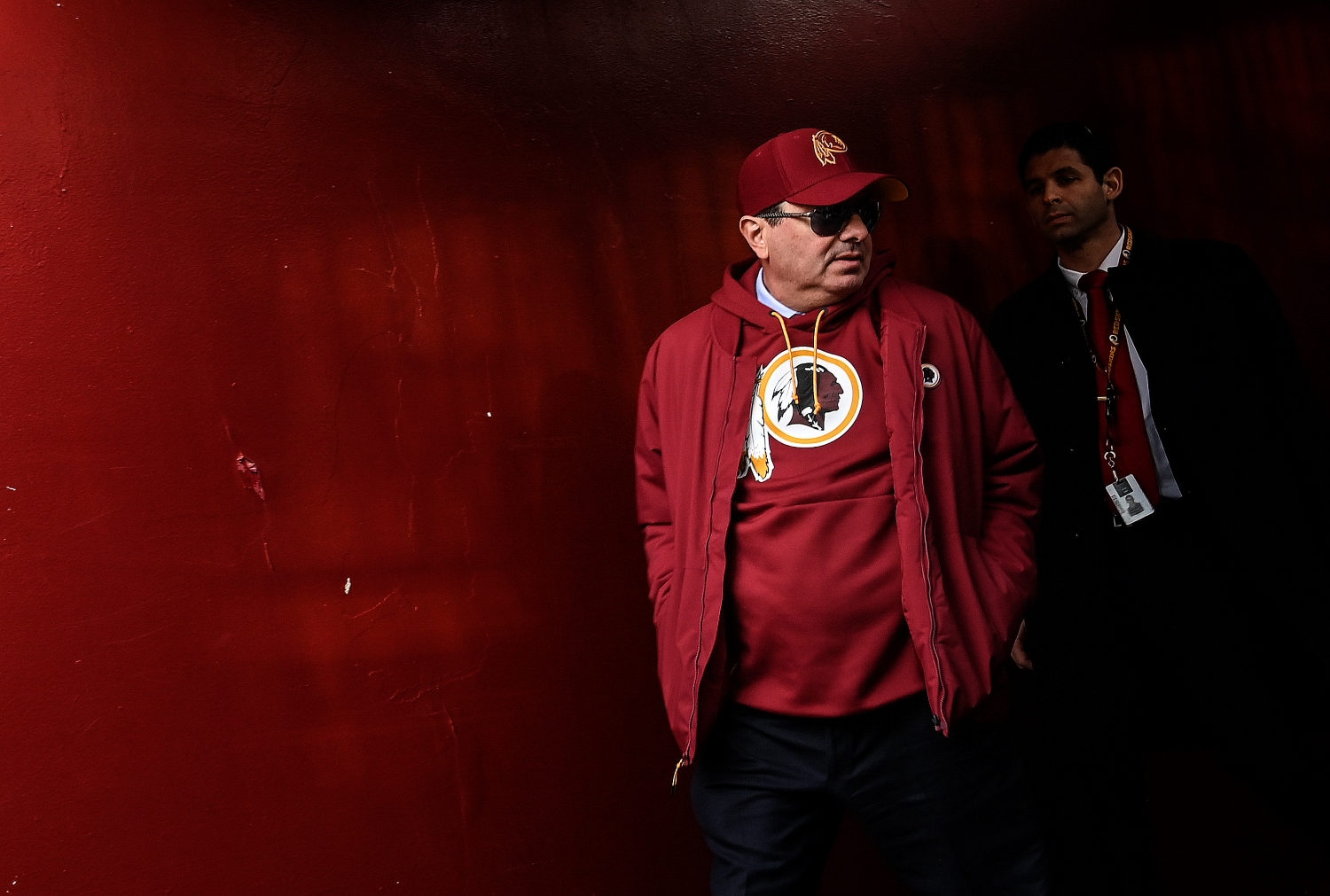 Washington Football Team owner Dan Snyder heads out to the field before a game.
