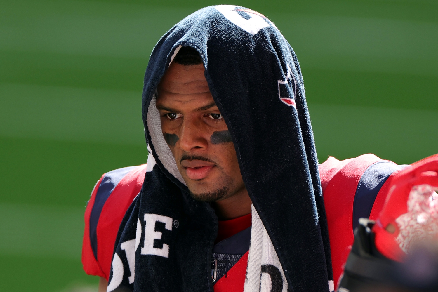 Houston Texans quarterback Deshaun Watson walks with a towel draped over his head during a game against the Indianapolis Colts.