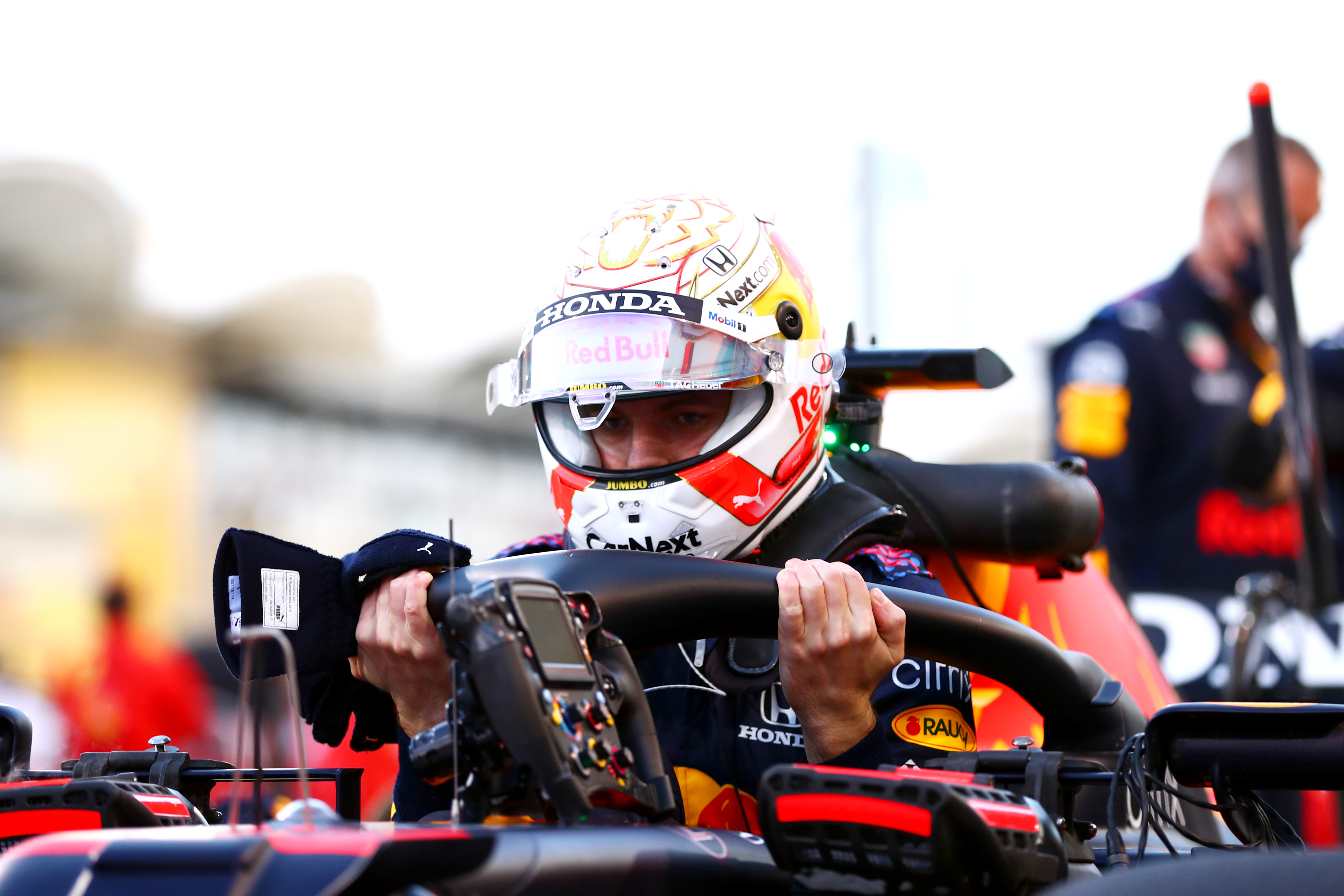 Max Verstappen of Red Bull Racing gets out of his car on the grid