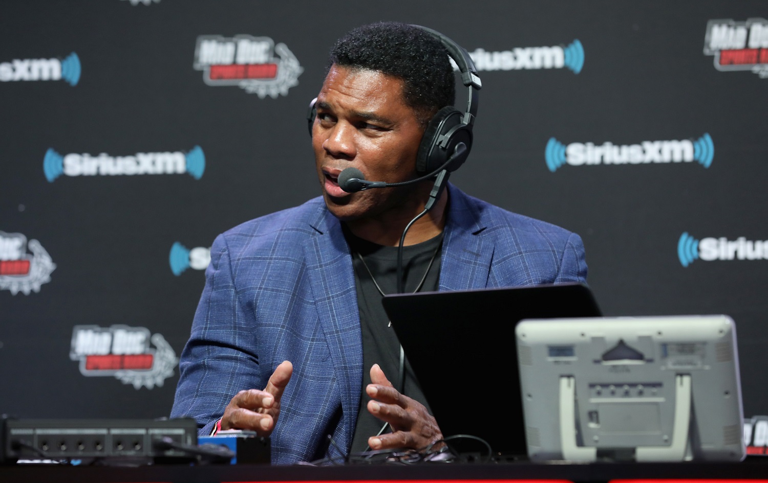 Retired college and pro football star Herschel Walker grew up in Georgia. He is considering a run for the U.S. Senate from the state. | Cindy Ord/Getty Images for SiriusXM