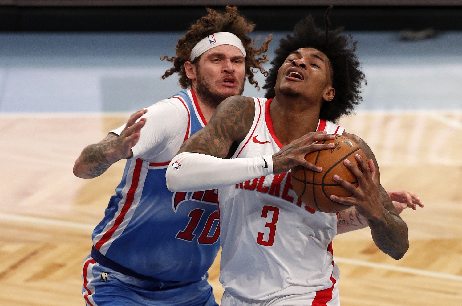 Kevin Porter Jr. of the Houston Rockets in action against Tyler Johnson of the Brooklyn Nets at Barclays Center on March 31, 2021 in New York City. | Jim McIsaac/Getty Images