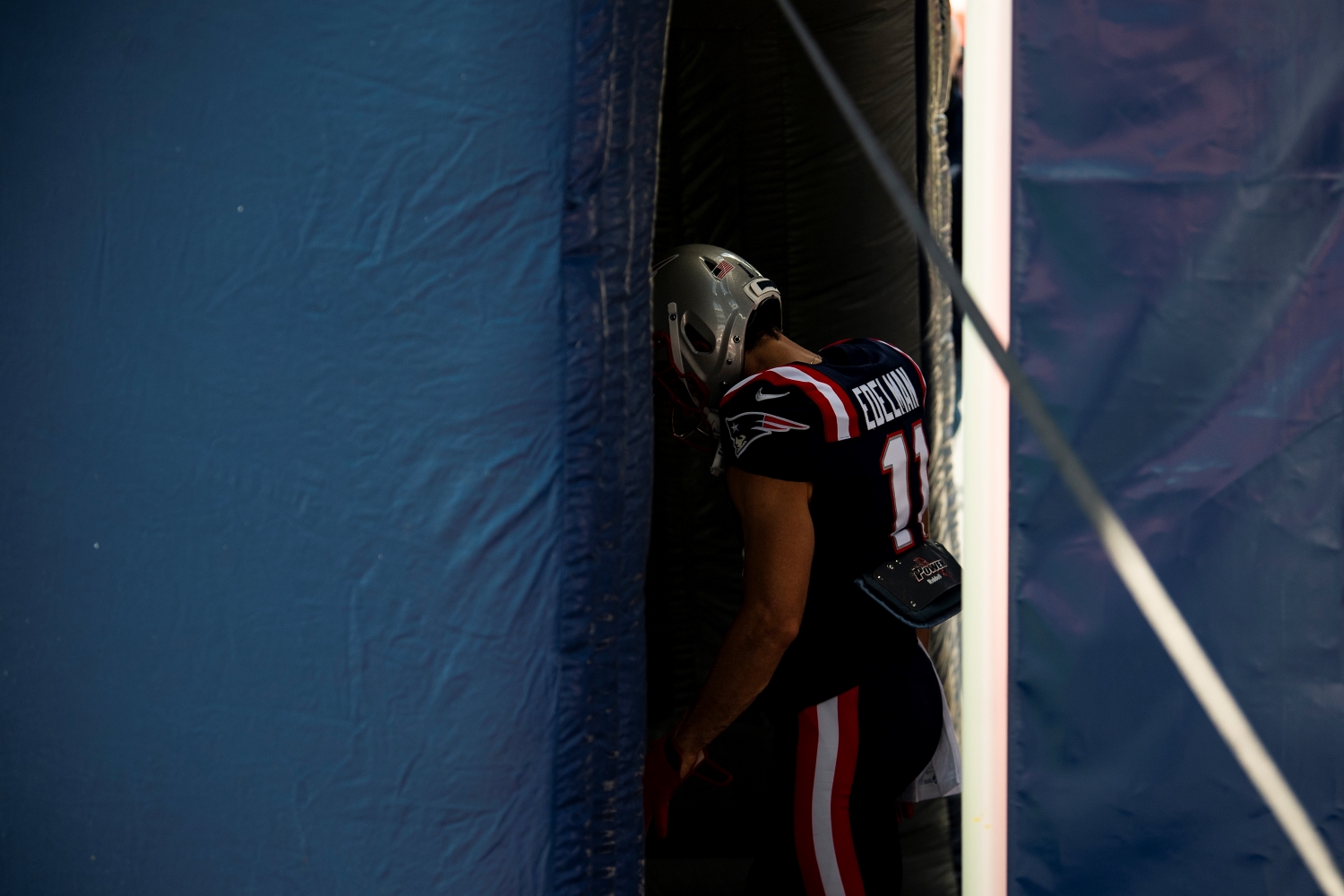New England Patriots receiver Julian Edelman walks through the tunnel before a 2020 game against the Denver Broncos.