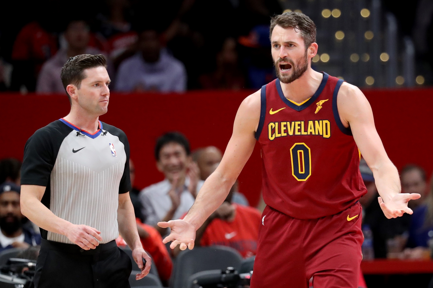 Cleveland Cavaliers forward Kevin Love argues a call with a referee.