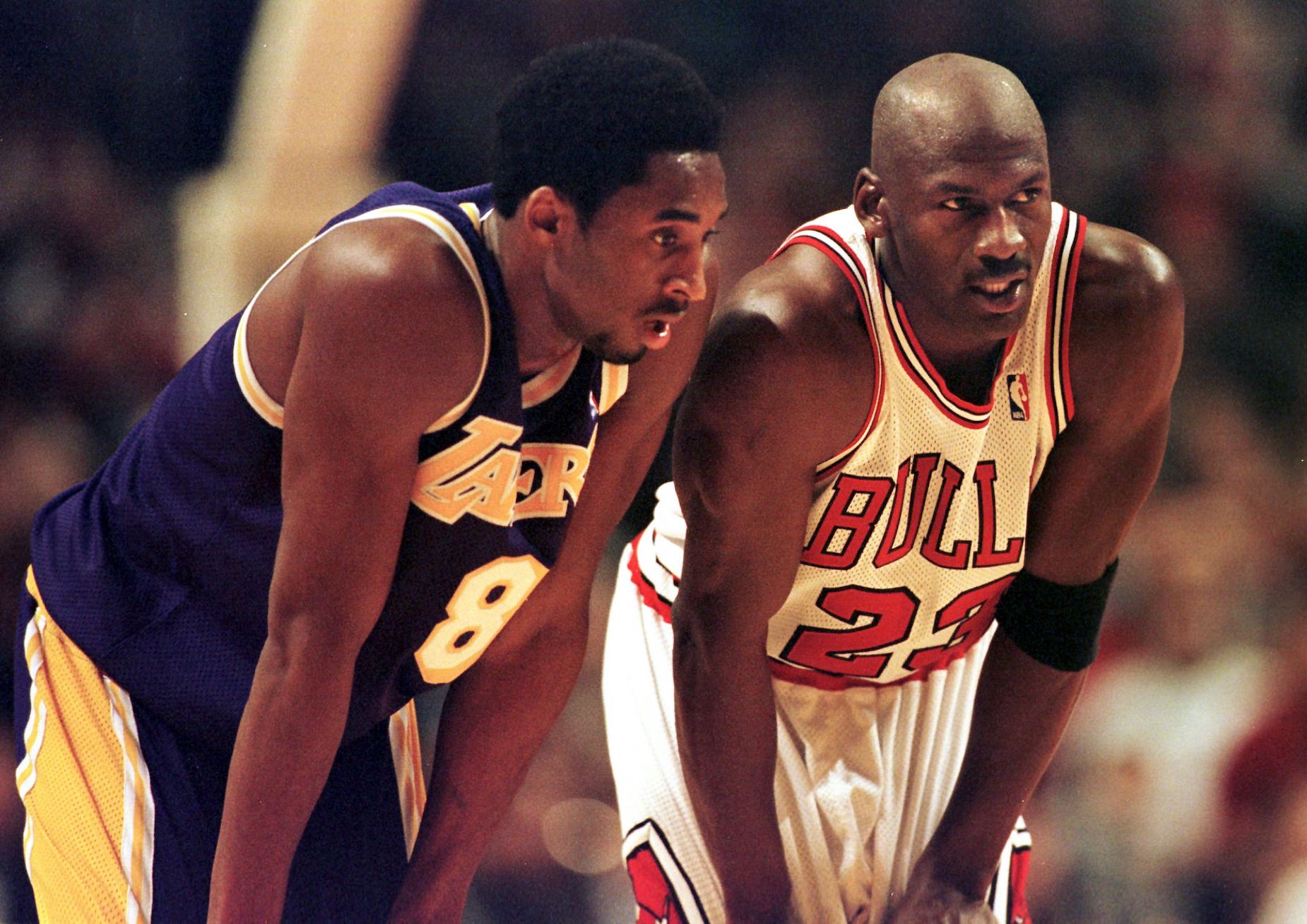 Kobe Bryant and Michael Jordan talk during a 1997 NBA game