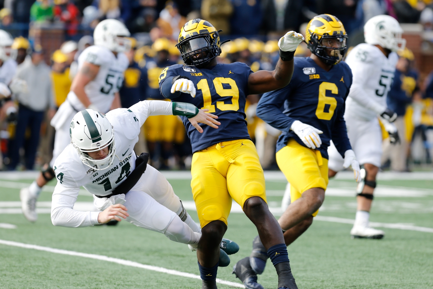 Top 2021 NFL draft prospect Kwity Paye knocks down Michigan State quarterback Brian Lewerke.