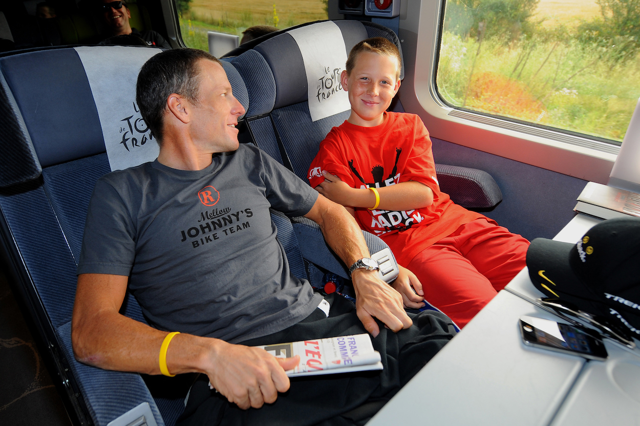 Lance Armstrong riding bus with son Luke