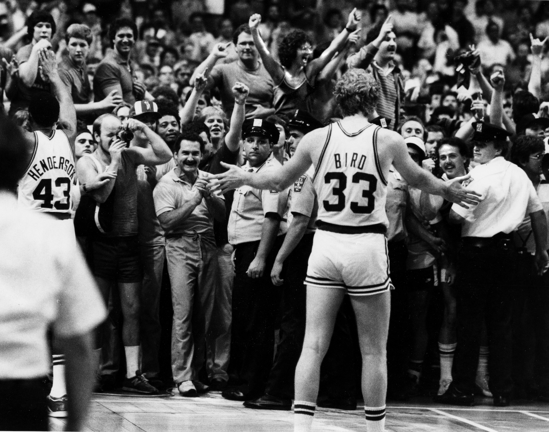 Boston Celtics star Larry Bird gestures to the crowd in 1984