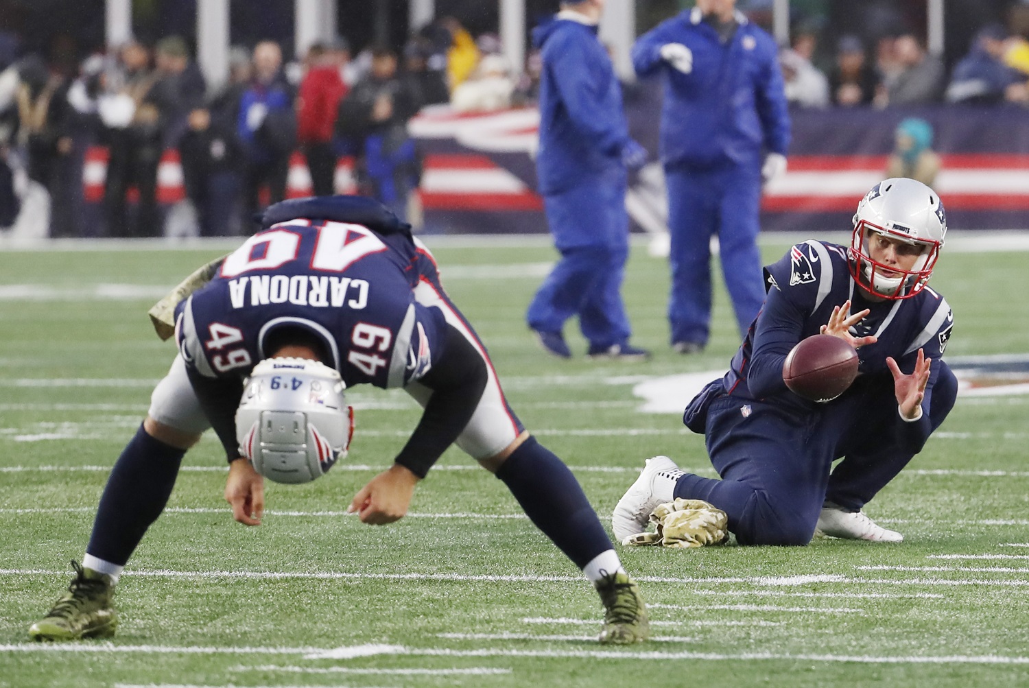 Punter Jake Bailey takes a snap from New England Patriots long snapper Joe Cardona during warm-ups before a game against the Dallas Cowboys on Nov. 24, 2019. | Fred Kfoury III/Icon Sportswire via Getty Images