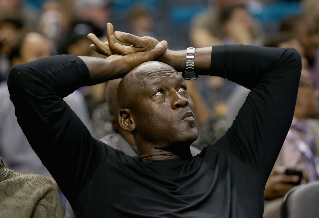 Michael Jordan looks on during a 2015 Charlotte Hornets game
