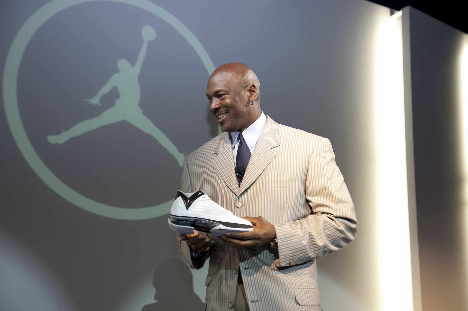Michael Jordan holds an Air Jordan shoe during a 2009 media event.
