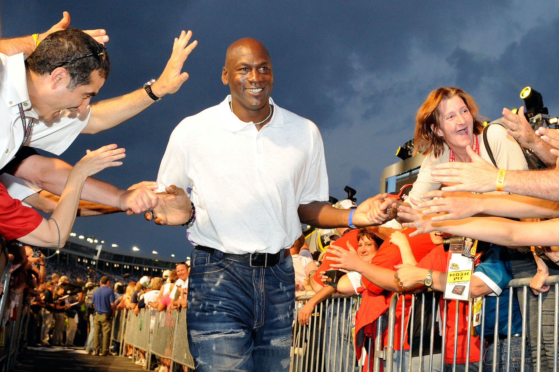 Michael Jordan high fives his fans at a 2010 NASCAR race.