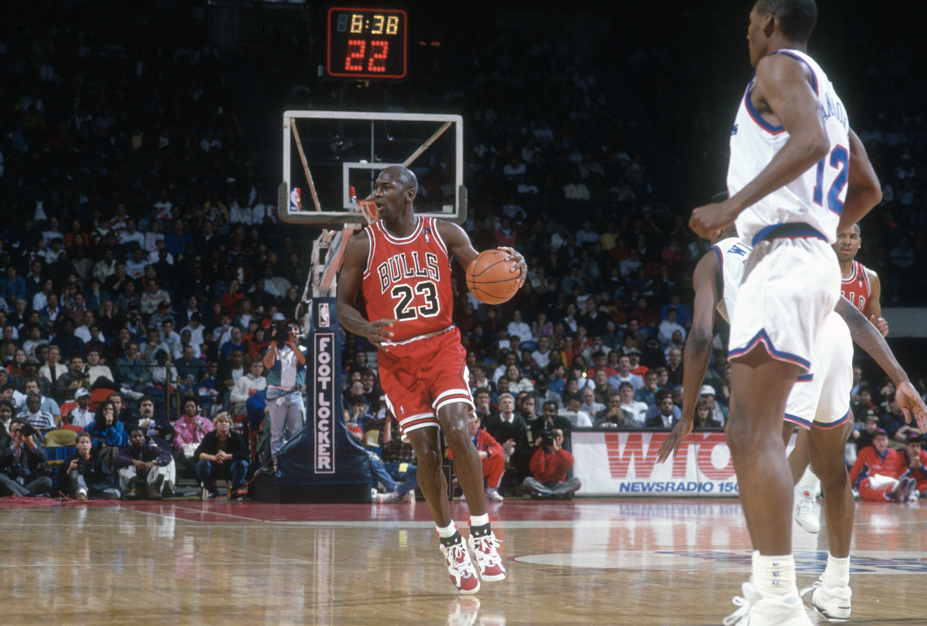 Michael Jordan dribbles down the court during a Chicago Bulls game.