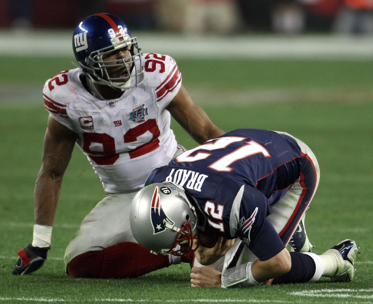 New York Giants legend Michael Strahan and former Patriots quarterback Tom Brady in the Super Bowl.