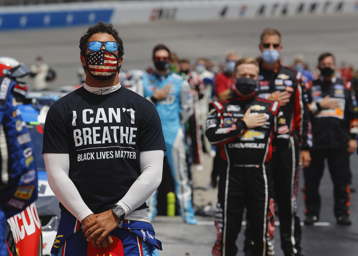 NASCAR Cup Series driver Bubba Wallace supported by fellow drivers.