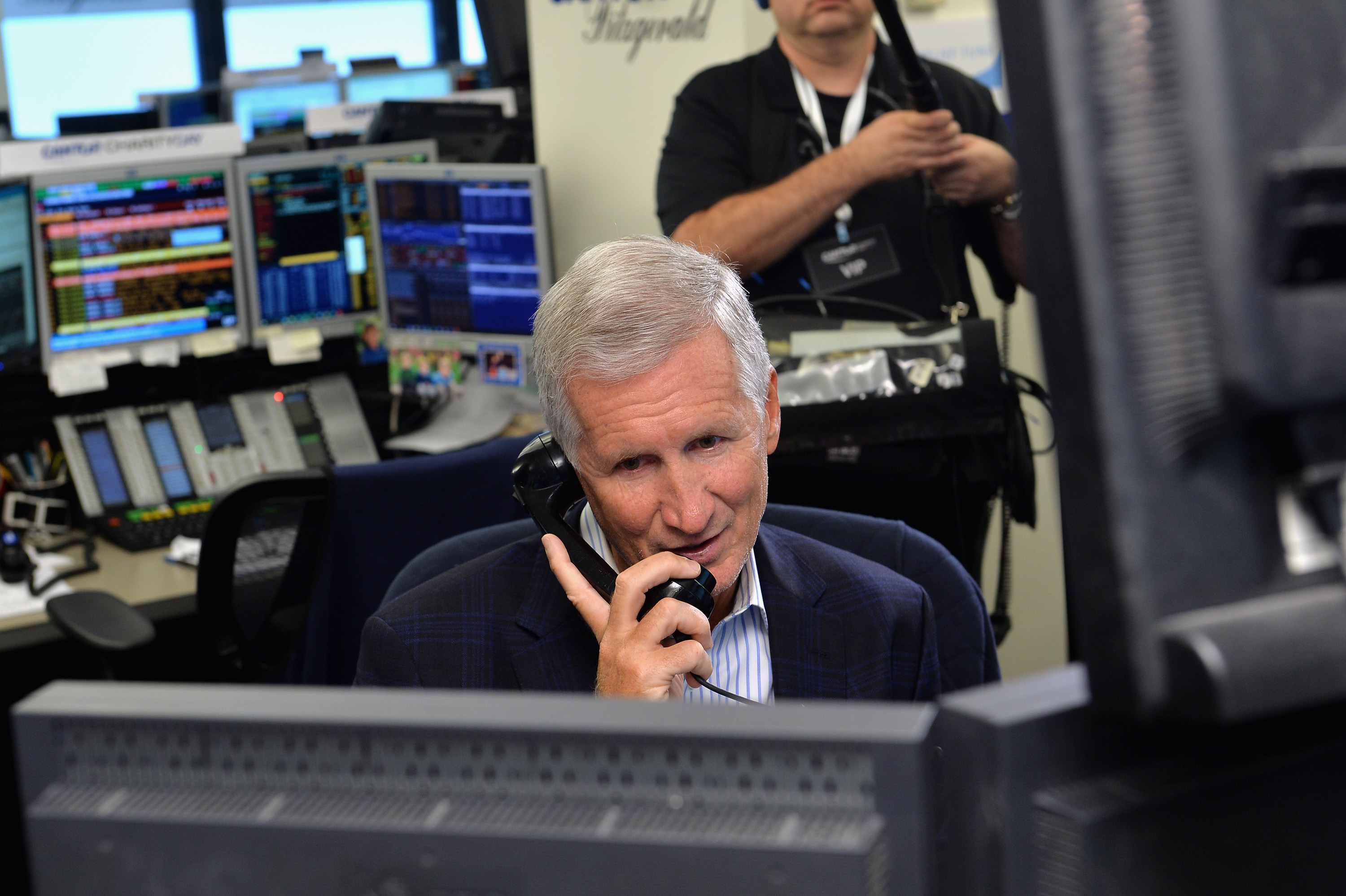 Sports commentator Mike Breen speaks on the phone