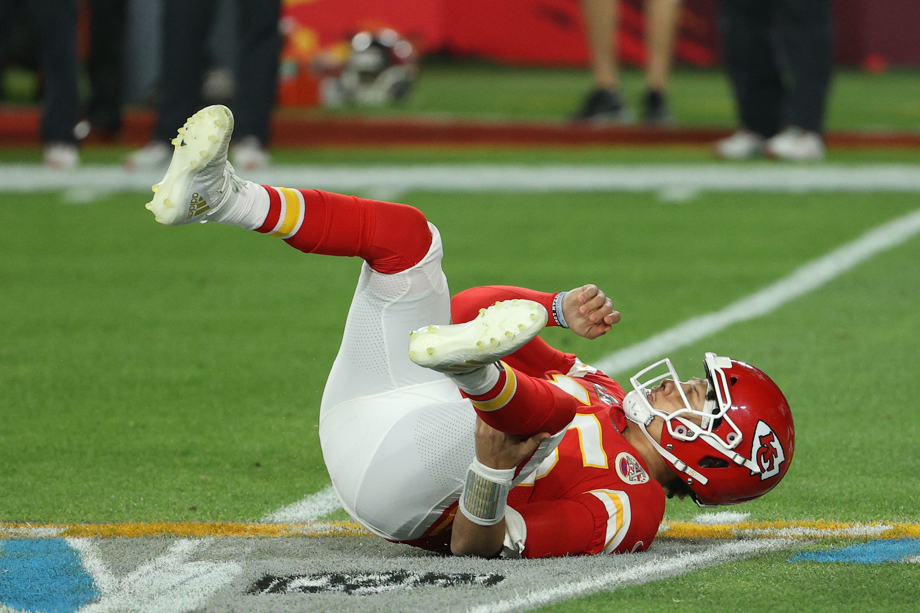 Kansas City Chiefs quarterback Patrick Mahomes lies on the turf during Super Bowl 55.