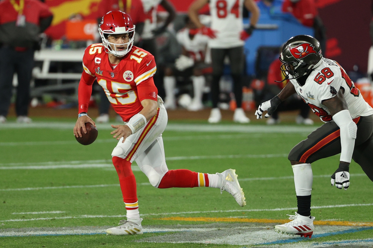 Kansas City Chiefs quarterback Patrick Mahomes tries to evade Tampa Bay Buccaneers linebacker Shaquil Barrett in Super Bowl 55.