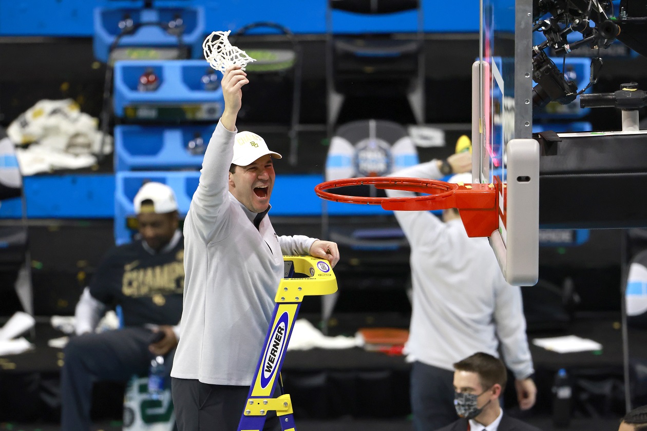 Baylor head coach Scott Drew cuts down the net after winning the national championship