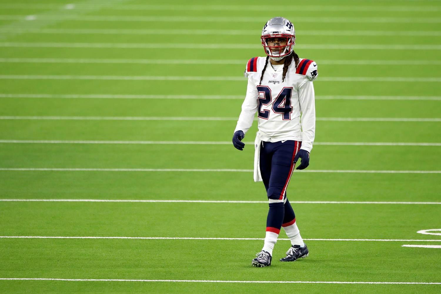 New England Patriots cornerback Stephon Gilmore walks on the field during the fourth quarter of a game against the LA Rams.