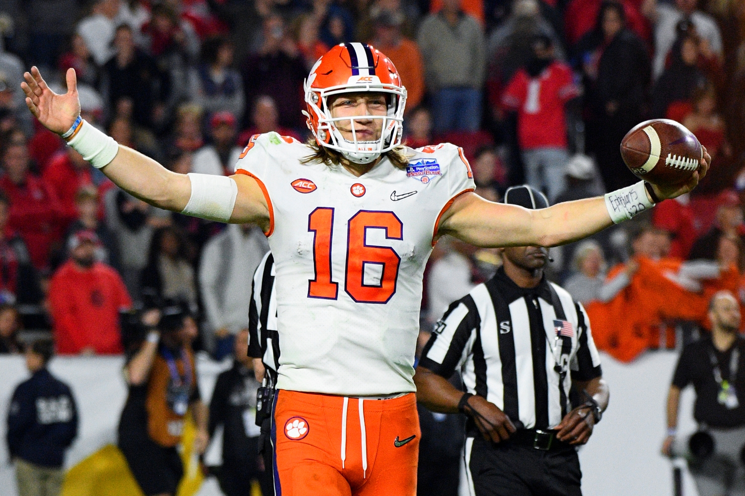 Top 2021 NFL draft prospect Trevor Lawrence celebrates at the end of a game from the 2019 college football season.