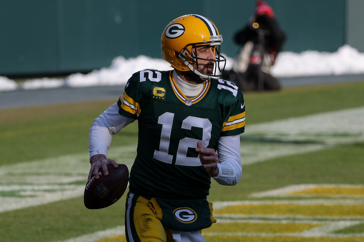 Aaron Rodgers of the Green Bay Packers runs with ball