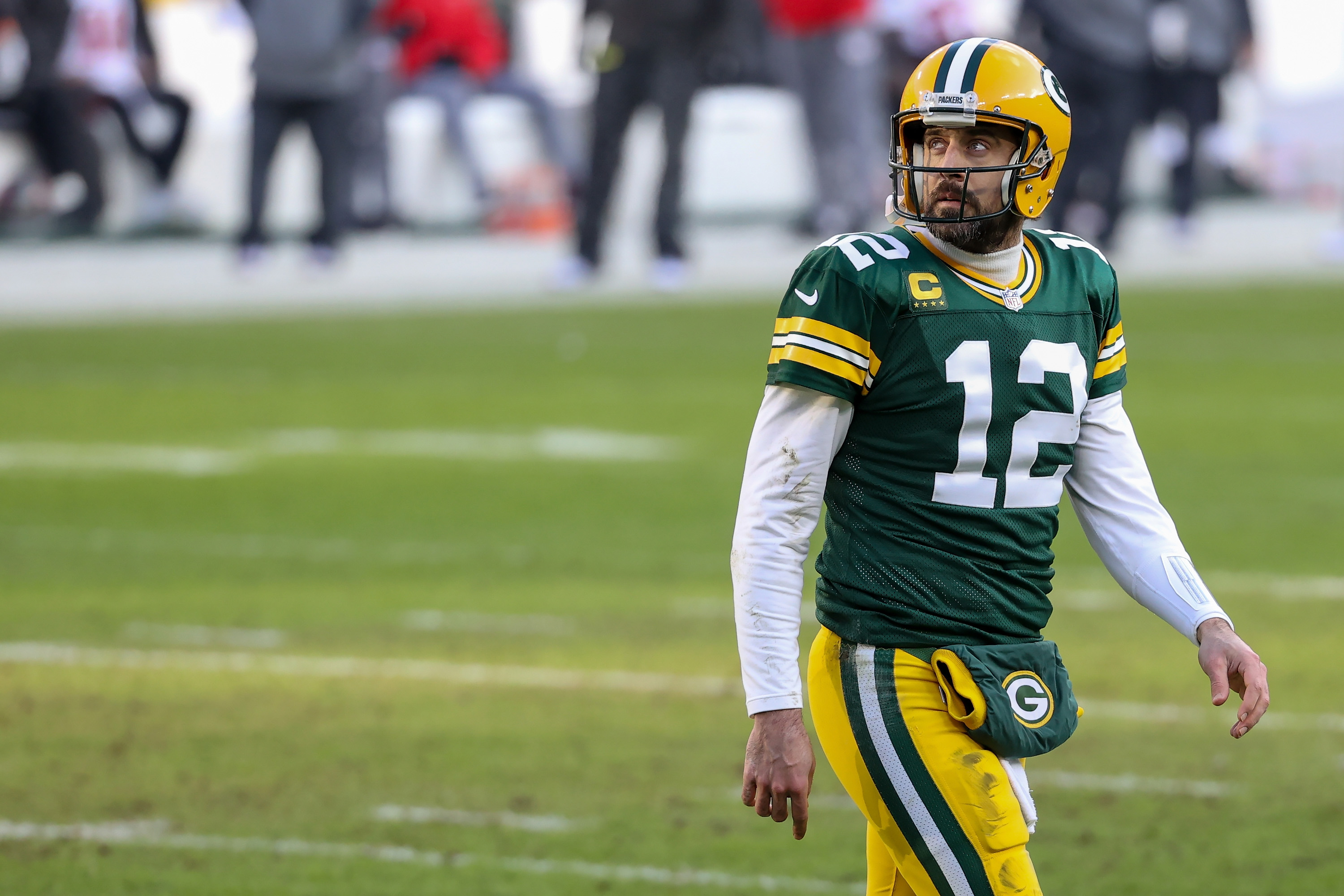 Aaron Rodgers of the Green Bay Packers walks across the field in the second quarter against the Tampa Bay Buccaneers during the NFC Championship game at Lambeau Field on January 24, 2021 in Green Bay, Wisconsin.