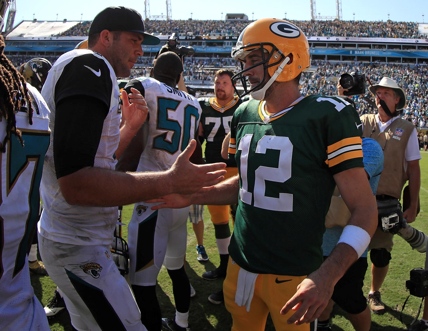 Blake Bortles and Aaron Rodgers shake hands after a game between the Jaguars and the Packers.