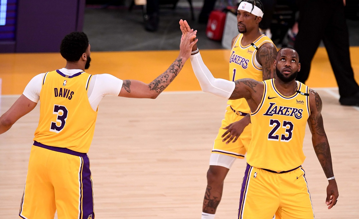 Anthony Davis and LeBron James high five during the Lakers' play-in tournament win over the Warriors