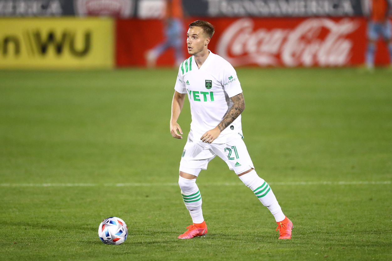 Austin FC player Zan Kolmanic passes ball