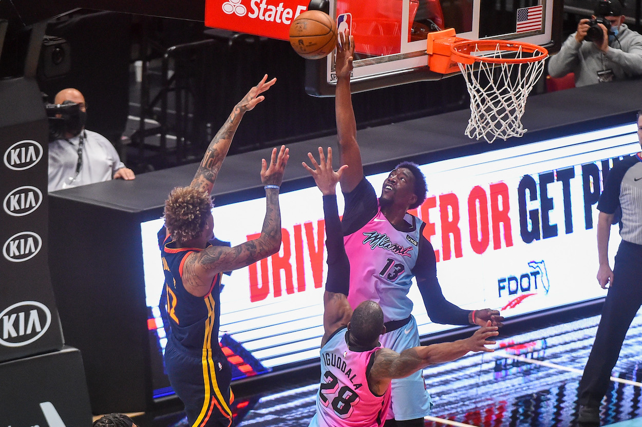Bam Adebayo of the Miami Heat blocks a shot attempt by Kelly Oubre Jr. of the Golden State Warriors during the second half of the game at the American Airlines Arena on April 1, 2021 in Miami, Florida.