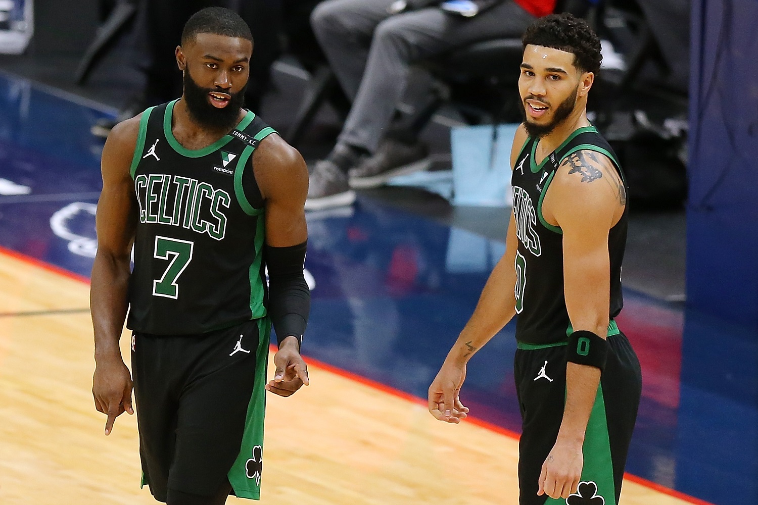 Jaylen Brown and Jayson Tatum of the Boston Celtics converse during a game againbst the New Orleans Pelicans on Feb. 21, 2021.