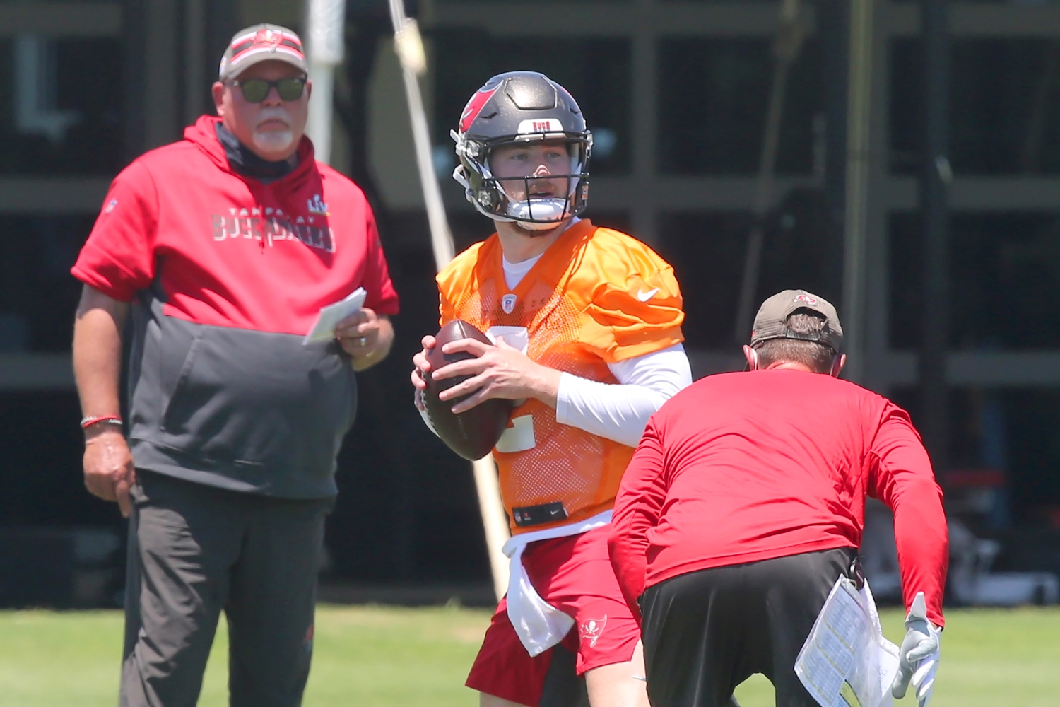 Buccaneers head coach Bruce Arians watches rookie quarterback Kyle Trask in practice.