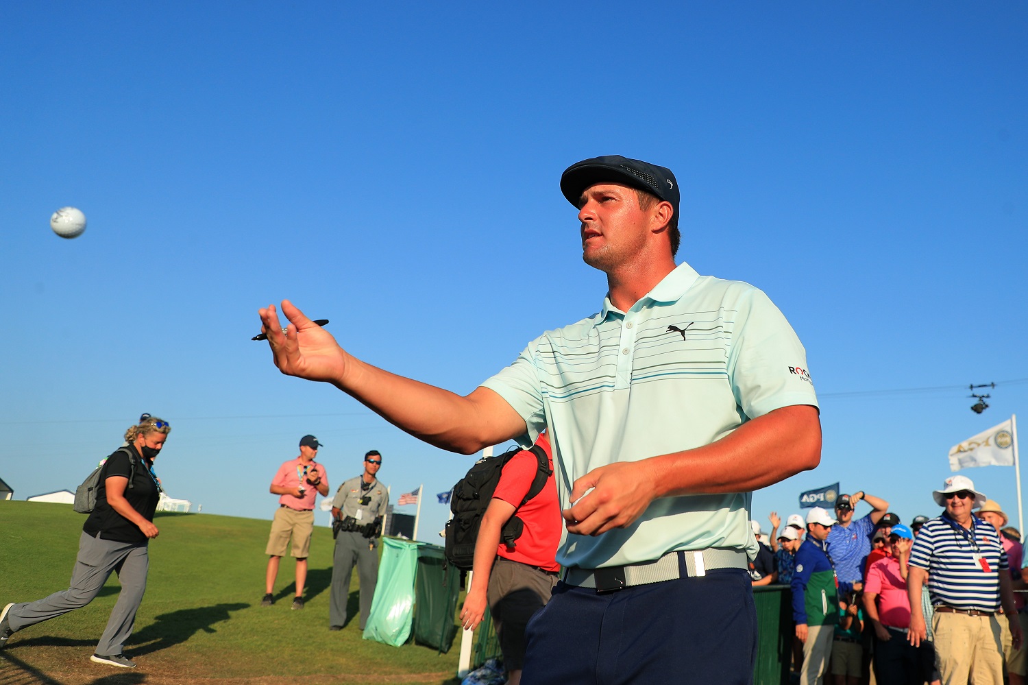 Bryson DeChambeau tosses his golf ball after playing the final round of the 2021 PGA Championship at the Ocean Course of Kiawah Island Golf Resort.