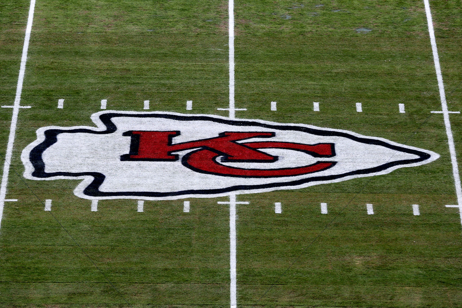 The Kansas City Chiefs logo painted on the field at Arrowhead Stadium.