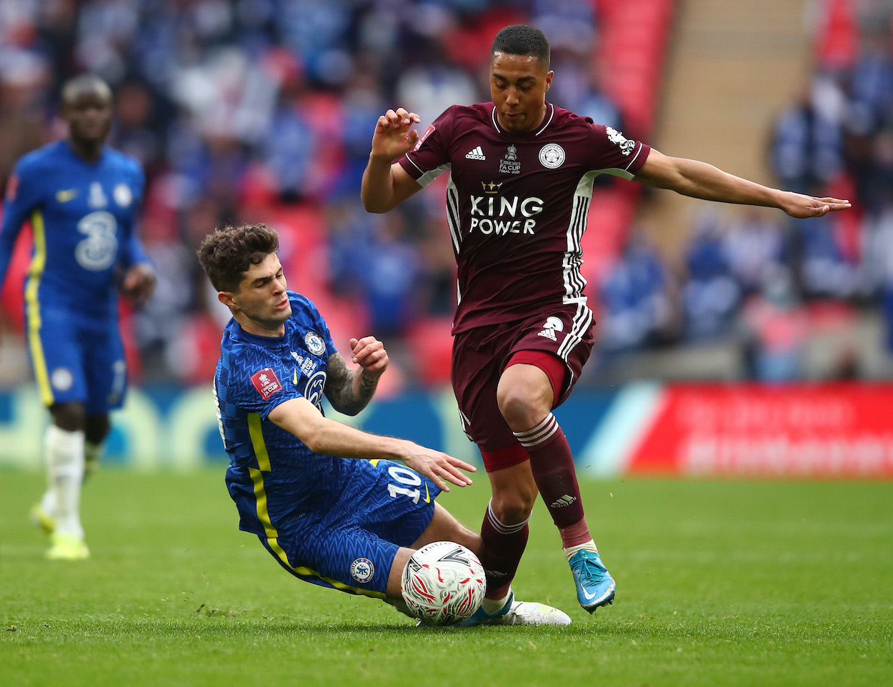 Christian Pulisic of Chelsea challenges Youri Tielemans of Leicester City during The Emirates FA Cup Final match between Chelsea and Leicester City at Wembley Stadium on May 15, 2021 in London, England.