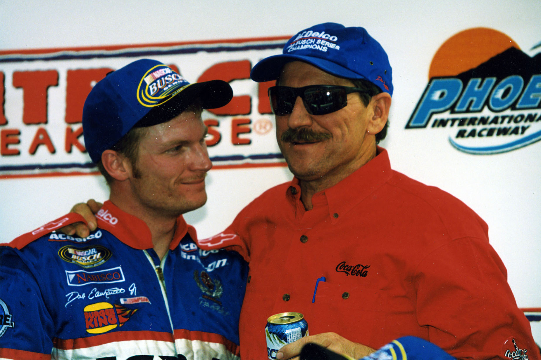 Dale Earnhardt and Dale Earnhardt Jr. celebrate after the younger driver clinched the 1999 NASCAR Grand National title.