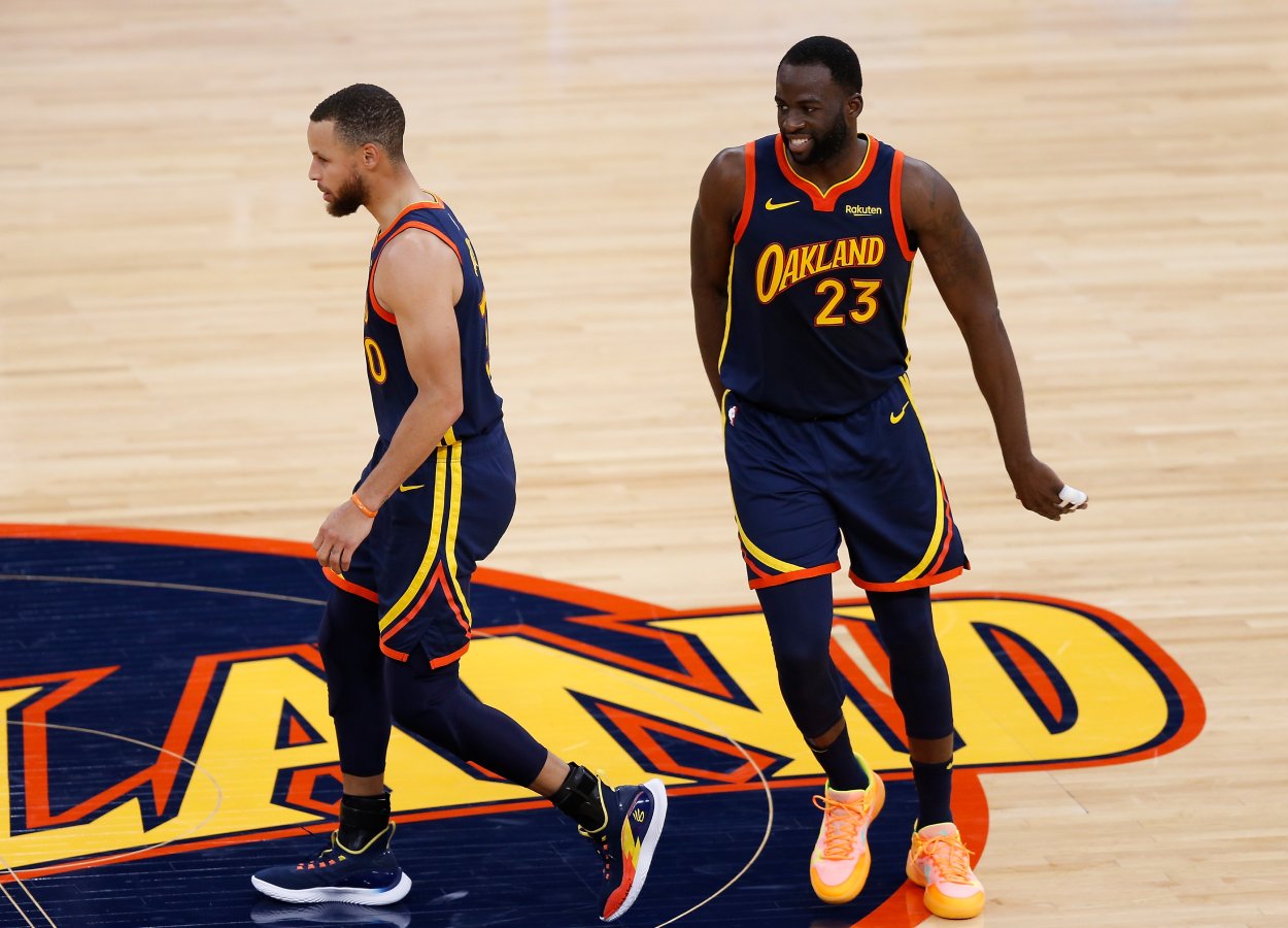 Golden State Warriors teammates Draymond Green and Stephen Curry in May 2021.