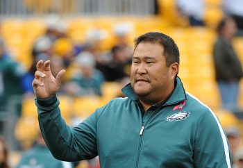 Offensive line assistant Eugene Chung of the Philadelphia Eagles looks on during warmups prior to a game against the Pittsburgh Steelers on Oct. 7, 2012,