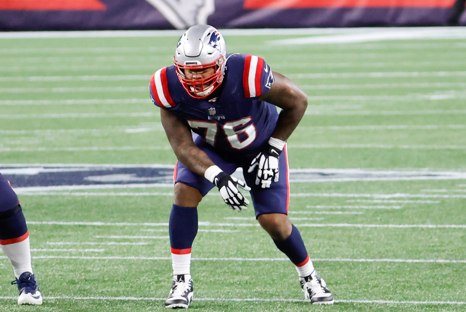 New England Patriots left tackle Isaiah Wynn lines up during a game.