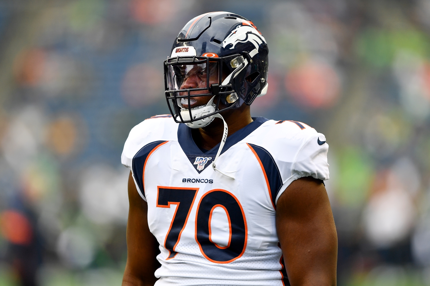 Denver Broncos right tackle Ja'Wuan James warms up before a preseason game.