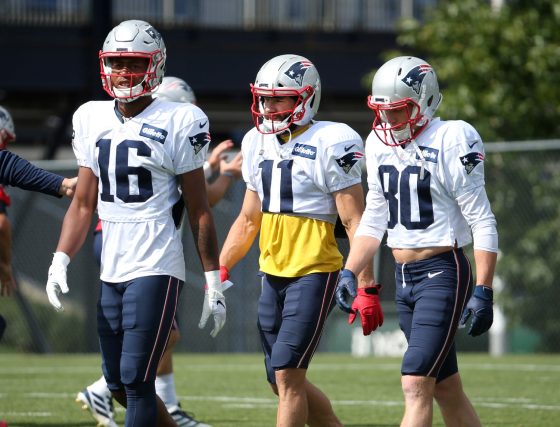 New England Patriots receivers Jakobi Meyers, Julian Edelman, and Gunner Olszewski walk together during practice.