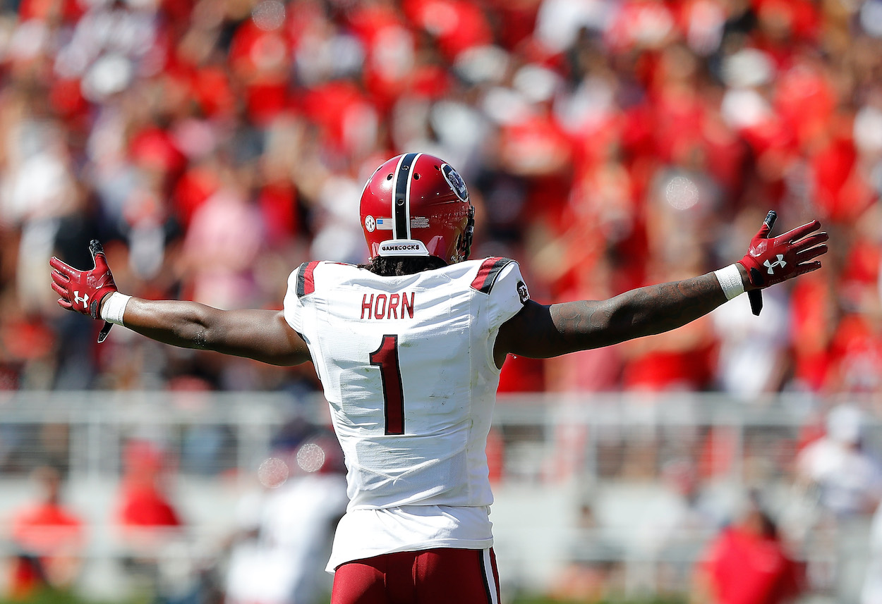 Jaycee Horn of the South Carolina Gamecocks reacts as Israel Mukuamu returns an interception for a touchdown in the first half against the Georgia Bulldogs at Sanford Stadium on October 12, 2019 in Athens, Georgia.