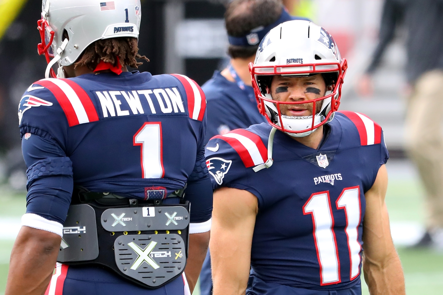 Julian Edelman talks with Cam Newton before the New England Patriots play the Miami Dolphins.