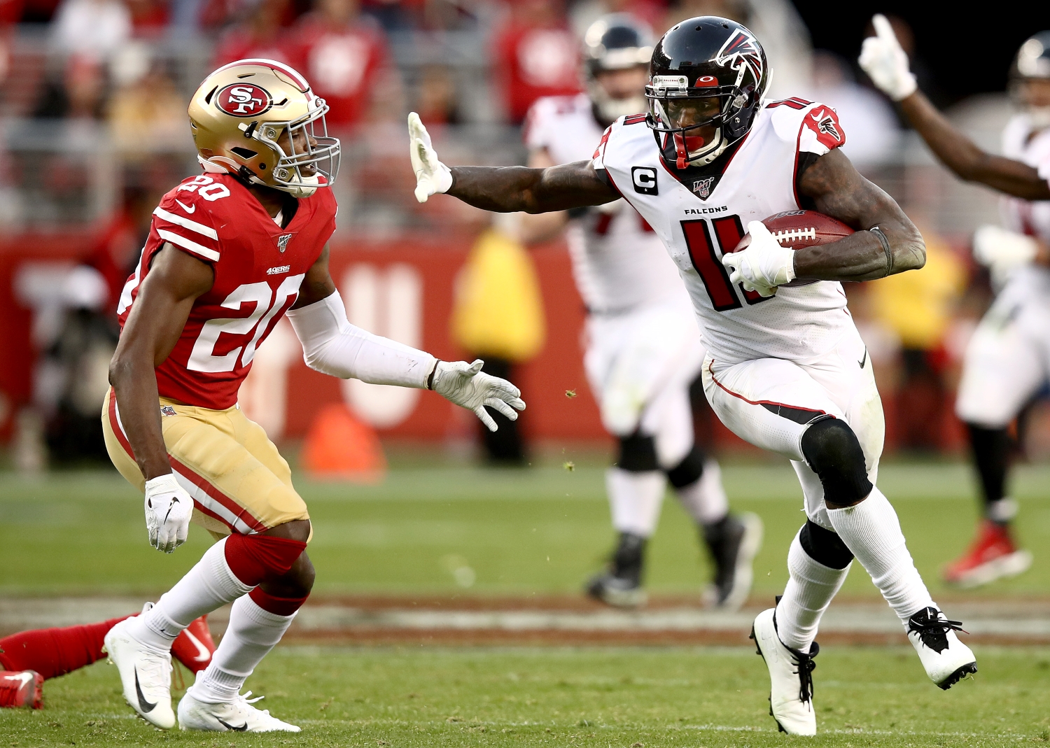 Atlanta Falcons WR Julio Jones runs away from 49ers safety Jimmie Ward.