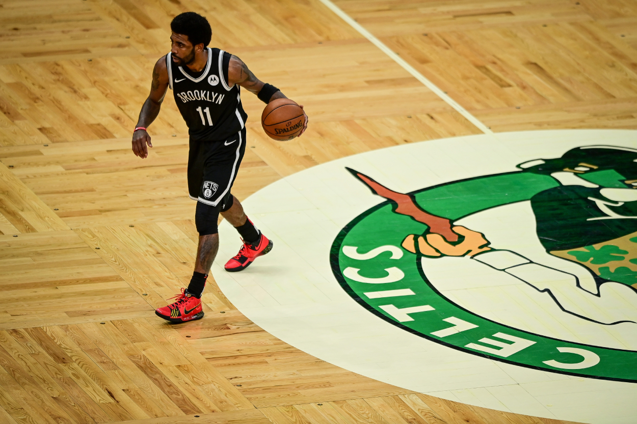 Kyrie Irving stomps on Celtics logo, gets water bottle thrown at him.
